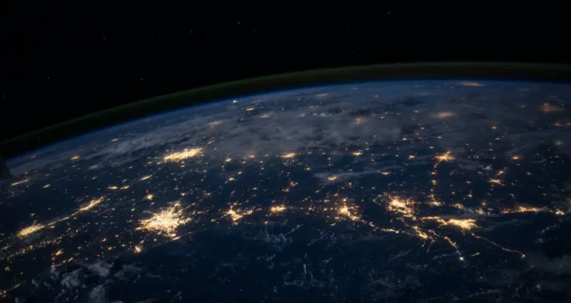 View of earth from space, with major cities showing light pollution